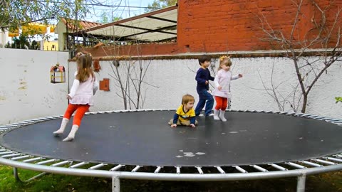 Children playing on a trampoline