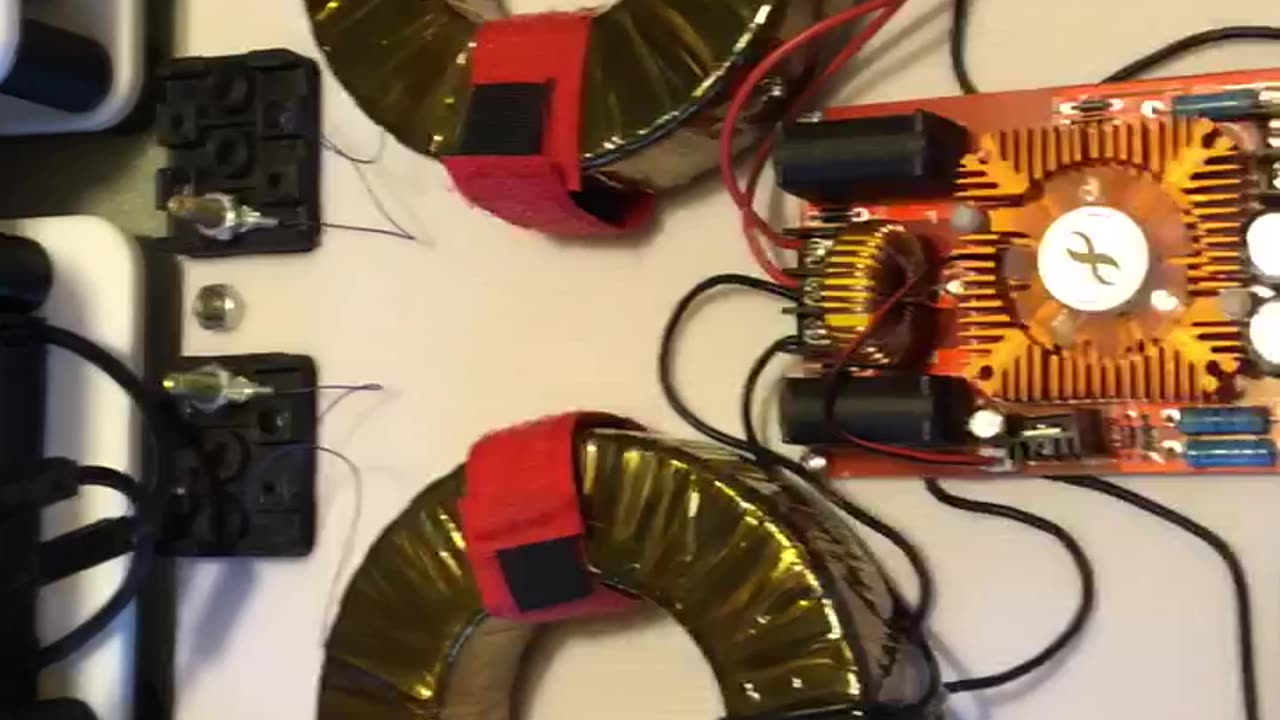 TESLA 2 phase. induction driven harmonic resonance midpoint core grounded earth grounded