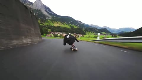 Outstanding longboard downhill with a jump and people