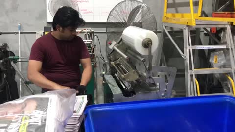Newspaper rolling machine