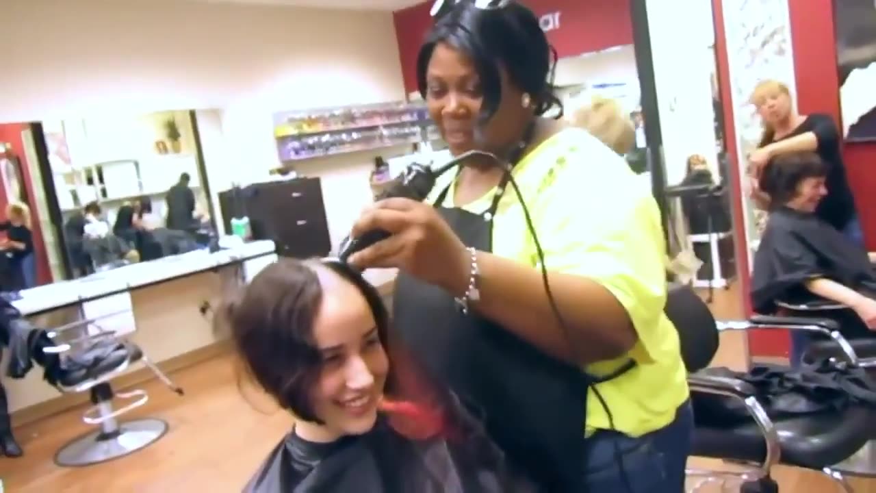 Cute teenage girl shaves her hair completely off in a salon - Headshave