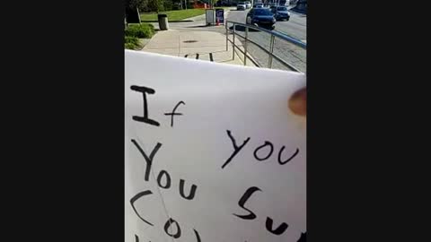 A Video of me Holding Signs talking to people in public