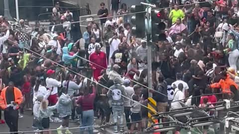Man Twerks at Pride While a Fight Breaks Out Nearby