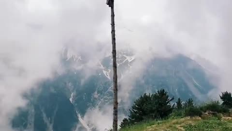 Pakistani flag waving on hills