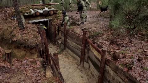 Ukrainian troops train in trenches on Belarus border