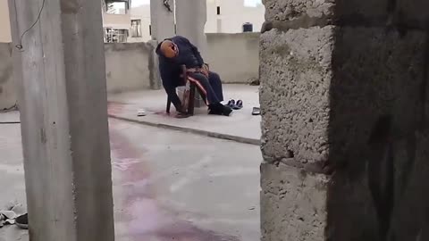 the Israeli army sniping an elderly citizen who was sitting on the roof of his house