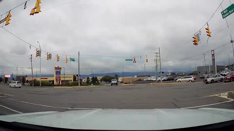 Car Runs Red Light in Front of Police