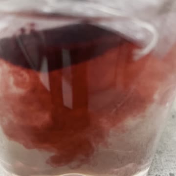 Red blast from a hibiscus bag in boiling water