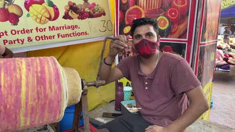 Ice Cream Making on Hand Roller Indian Street