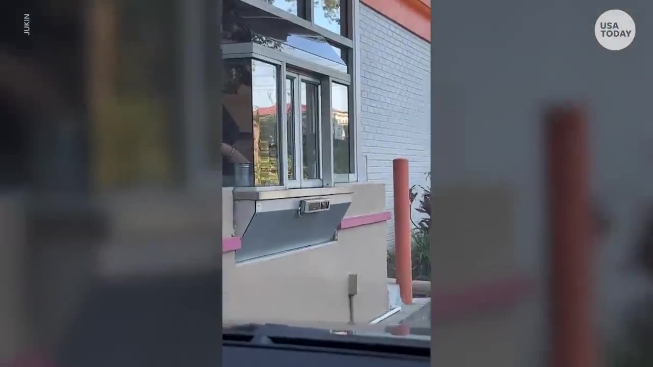 Raccoon orders a donut from the Dunkin' drive-thru window | USA TODAY