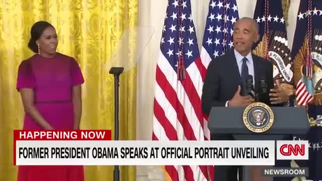 Barack Obama gives a speech after the unveiling of his White House portrait