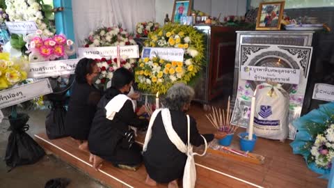 People pray for Thailand mass shooting victims at temple