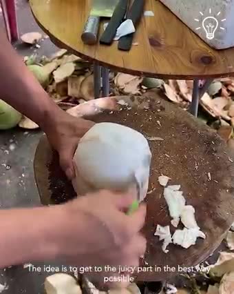 Cutting a coconut to get to the juicy part