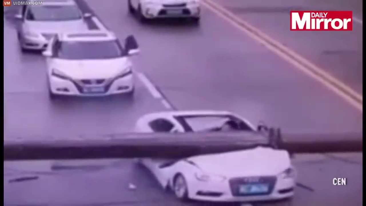 A Driver Miraculously Climbs Out of Crushed Car