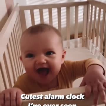 wake up a son in the bed with joy.