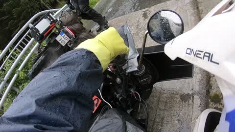 Bikers Topple on Rain Slick Bridge