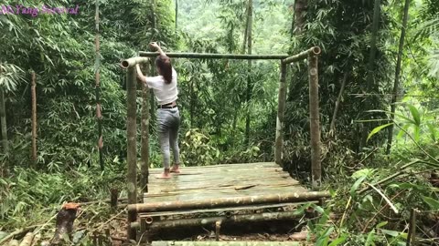 Girl building bamboo house alone in the forest,Find food in the stream