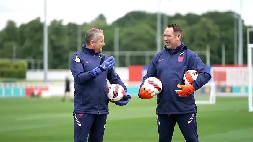 The coach is explaining the technical essentials to everyone.
