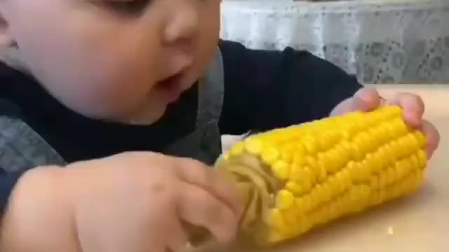 This baby was surprised the first time he saw corn
