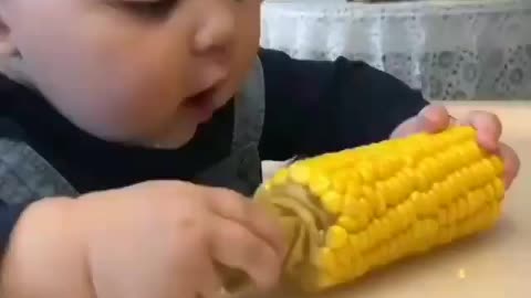 This baby was surprised the first time he saw corn