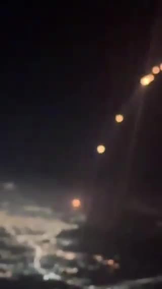 Footage taken aboard aircraft bound for Dubai captures missiles being fired from Iran towards Israel