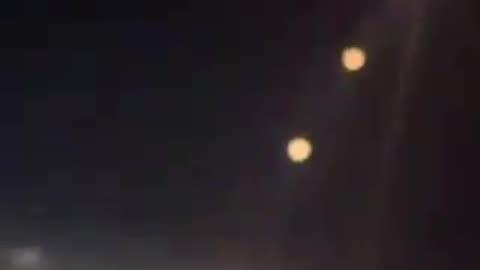 Footage taken aboard aircraft bound for Dubai captures missiles being fired from Iran towards Israel
