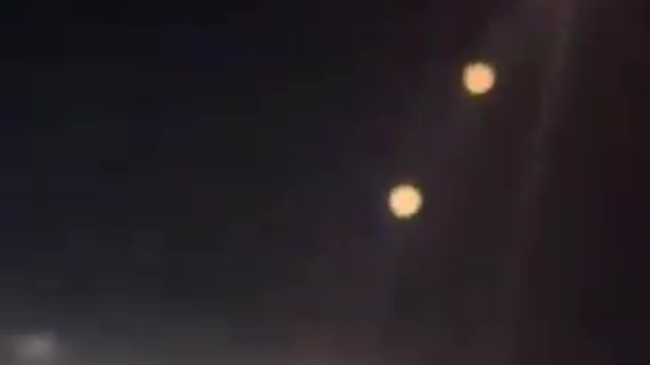 Footage taken aboard aircraft bound for Dubai captures missiles being fired from Iran towards Israel