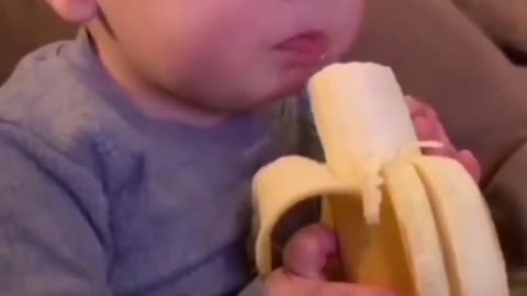 Baby doing banana breakfast