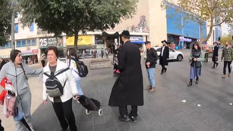 With some persecution. Preaching the gospel at Jerusalem central station.