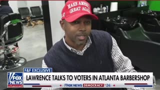 Lawrence talks to voters in Atlanta barbershop