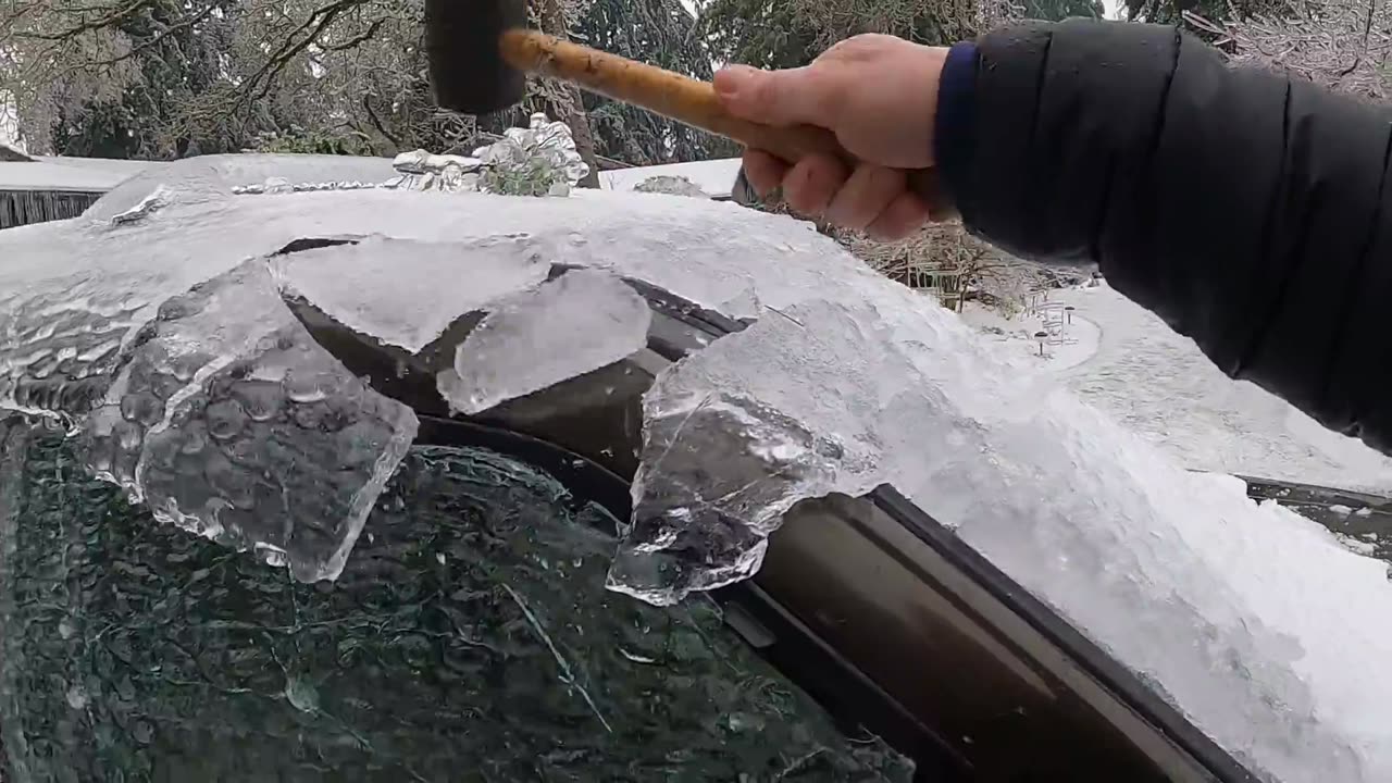 Freeing my Truck of thick ice from last nights storm using a rubber mallet
