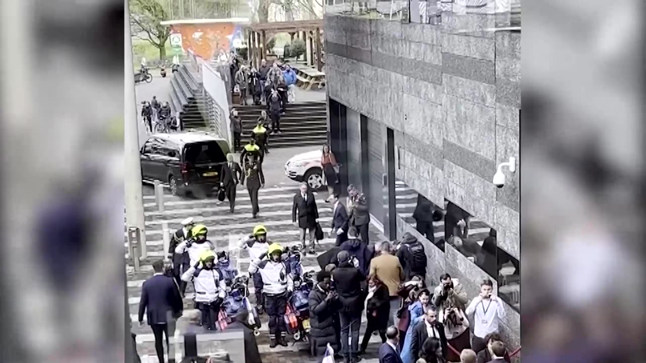 Police tackle protester running toward French president