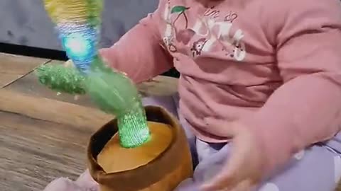 Baby with cactus toys