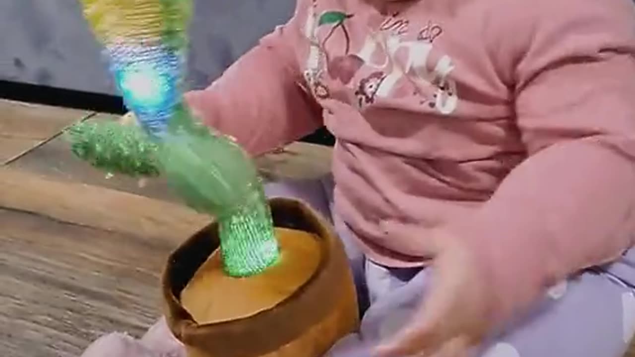 Baby with cactus toys