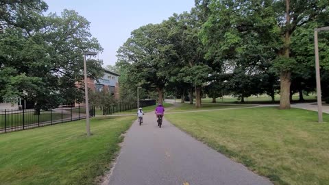 Bicycling through campus of Michigan State University, east side of campus / athletic fields