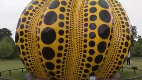 6-meter tall, yellow, polka-dotted pumpkin sculpture by Japanese artist Yayoi Kusama
