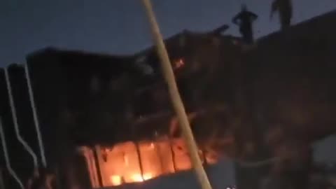 Iraqis have surrounded the MBC office building in Baghdad, with fires breaking out nearby