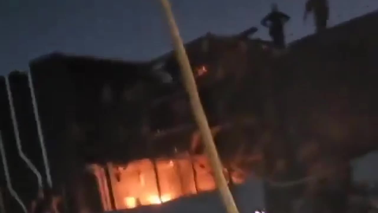 Iraqis have surrounded the MBC office building in Baghdad, with fires breaking out nearby