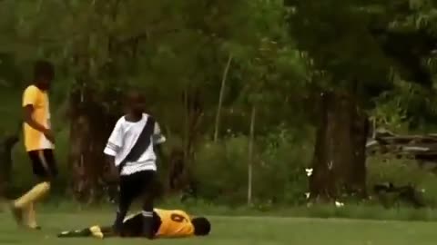 Sarcastic football tackle by a kid