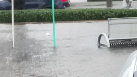 Man Kayaking on Flooded Street