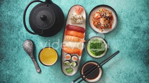 Asian food assortment Various sushi rolls placed on ceramic plates