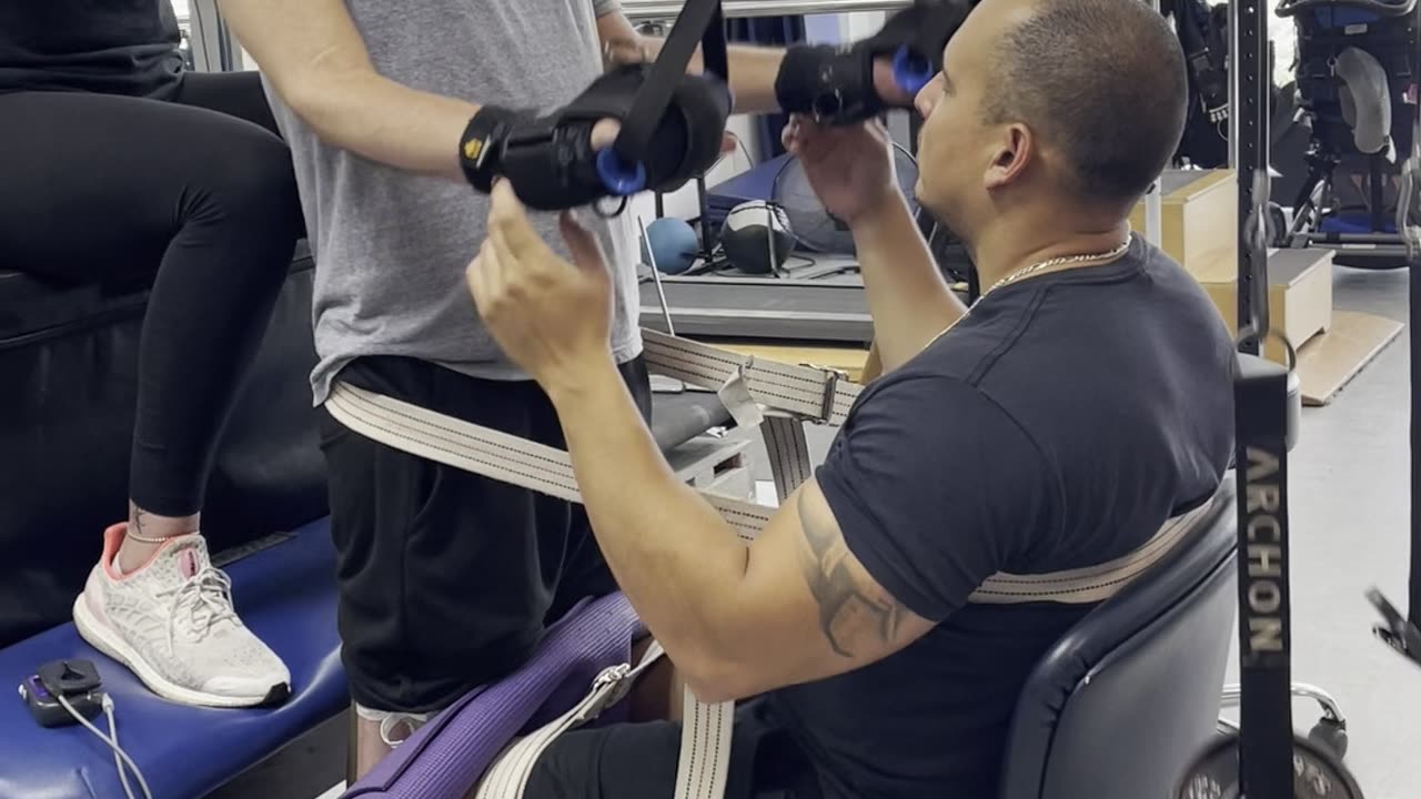 Two arm isolated tricep extensions by a quadriplegic