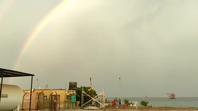 Rainbow phenomenon from the Ras Fanar oil fields in Ras Ghareb