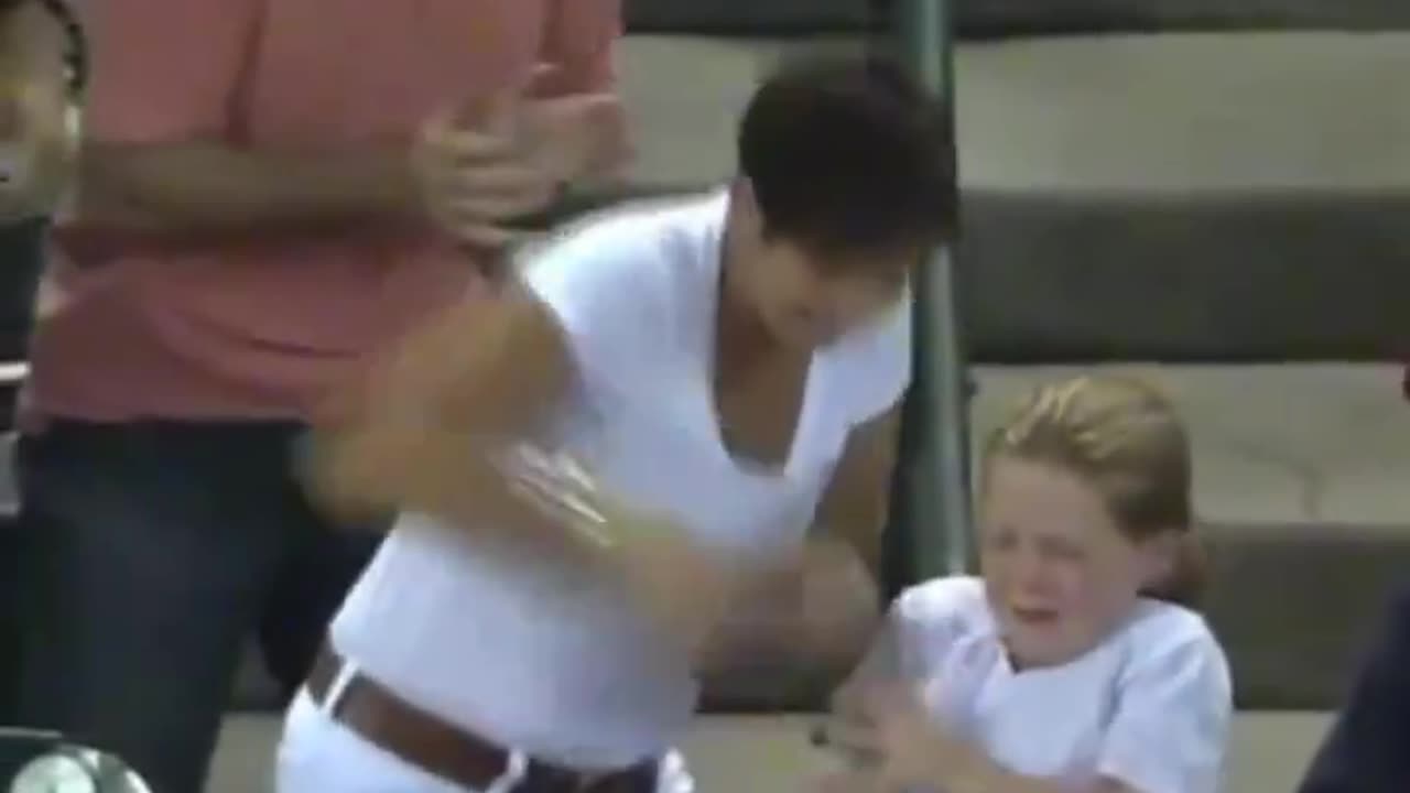 Woman Snatches Game Ball From Child