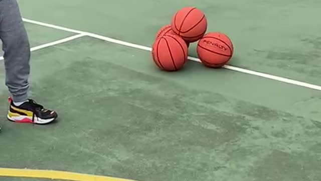 Mesmerizing Stack of Basketballs Roll Together