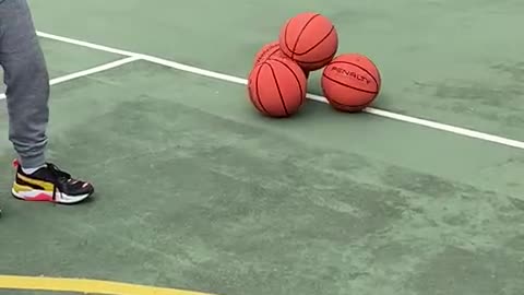 Mesmerizing Stack of Basketballs Roll Together