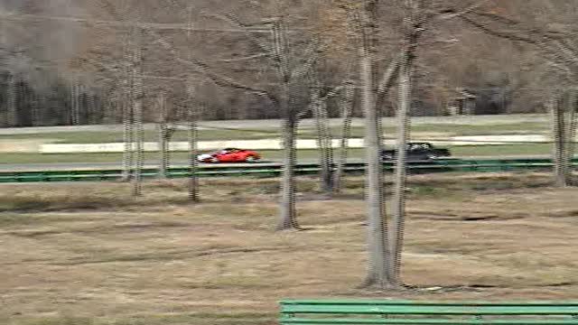 Old Lincoln Hounding a Ferrari at VIR