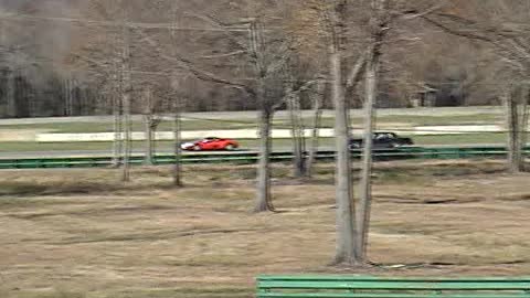 Old Lincoln Hounding a Ferrari at VIR