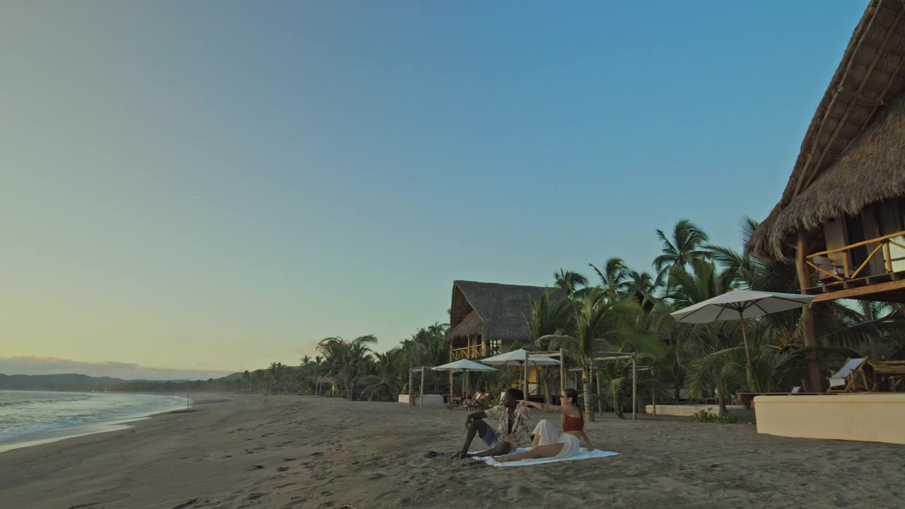 couple watching the sunset on beach