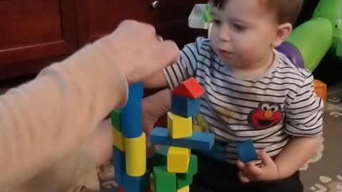 Stacking blocks with grandma.